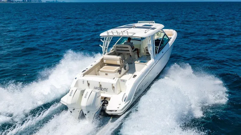  Yacht Photos Pics 2019 Boston Whaler 320 Vantage cruising on open ocean waters.