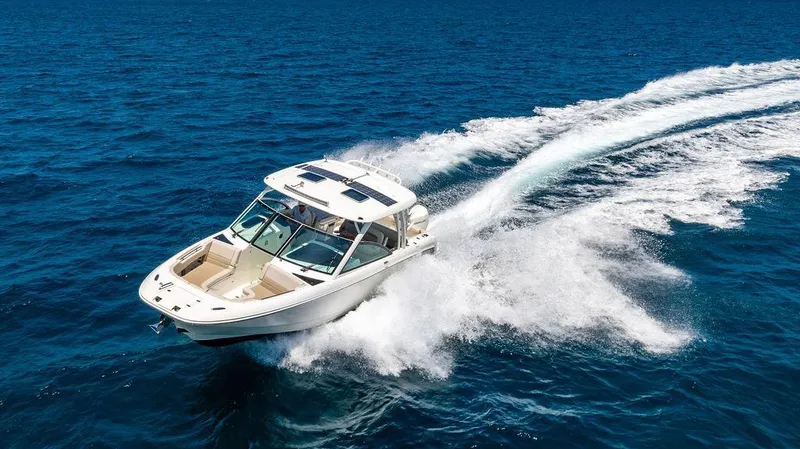  Yacht Photos Pics 2019 Boston Whaler 320 Vantage cruising on open blue ocean waters.