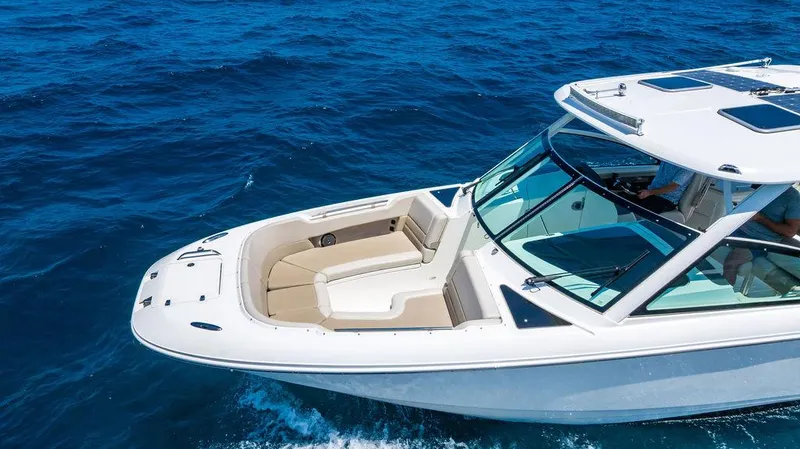  Yacht Photos Pics 2019 Boston Whaler 320 Vantage cruising on open blue sea.
