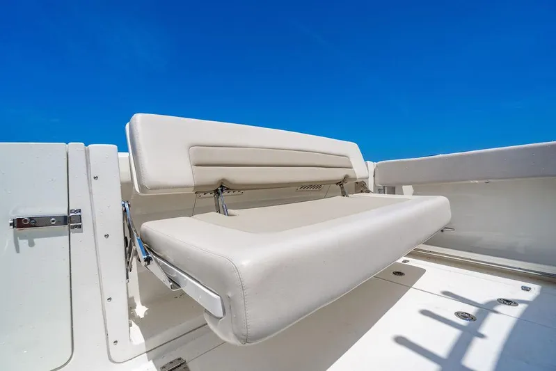  Yacht Photos Pics 2019 Boston Whaler 320 Vantage boat seat against clear blue sky.