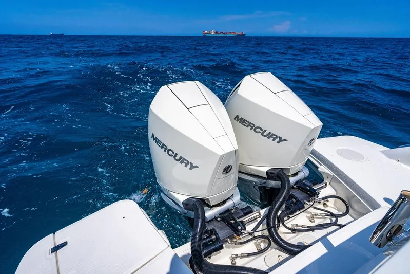  Yacht Photos Pics 2019 Boston Whaler 320 Vantage with dual Mercury outboard engines on open sea.