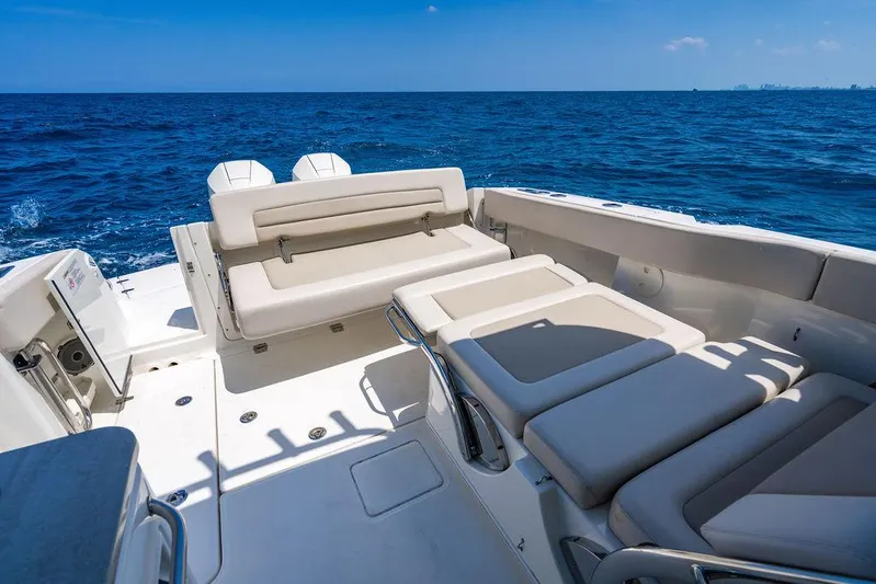  Yacht Photos Pics 2019 Boston Whaler 320 Vantage boat interior with seating, on open ocean.