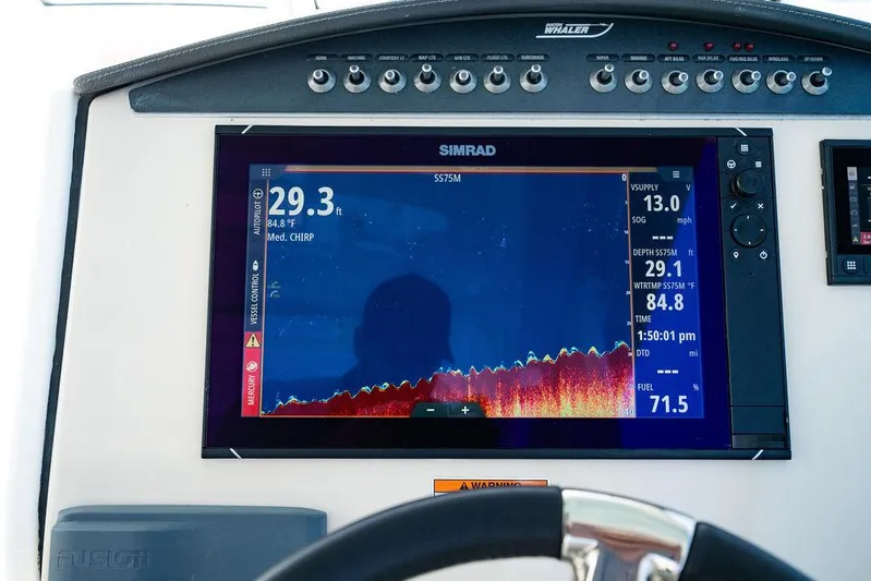  Yacht Photos Pics 2019 Boston Whaler 320 Vantage dashboard with Simrad display showing navigation and depth data.