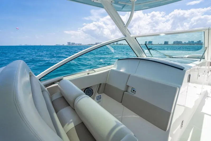  Yacht Photos Pics 2019 Boston Whaler 320 Vantage boat interior with ocean view and city skyline.
