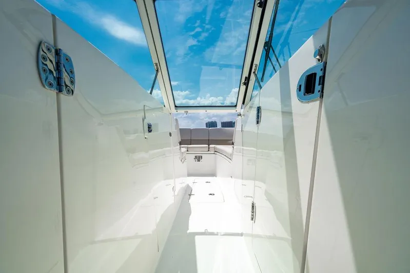  Yacht Photos Pics 2019 Boston Whaler 320 Vantage interior with sleek design and clear sky view.
