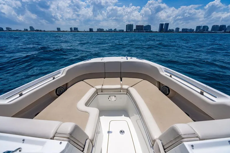  Yacht Photos Pics 2019 Boston Whaler 320 Vantage boat with spacious seating, cruising on open water.