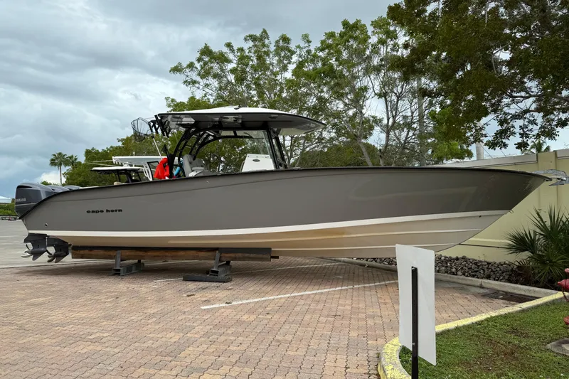 Thirty Percent Yacht Photos Pics 2021 Cape Horn 36 XS boat on display, parked on a paved area with trees in the background.