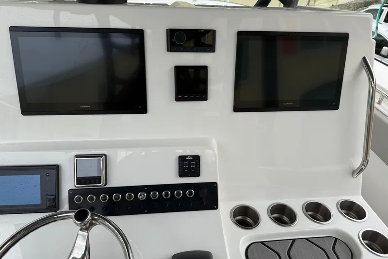 Thirty Percent Yacht Photos Pics 2021 Cape Horn 36 XS boat dashboard with Garmin displays and control panel.