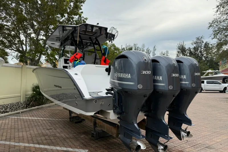 Thirty Percent Yacht Photos Pics 2021 Cape Horn 36 XS boat with triple Yamaha 300 engines, parked outdoors.