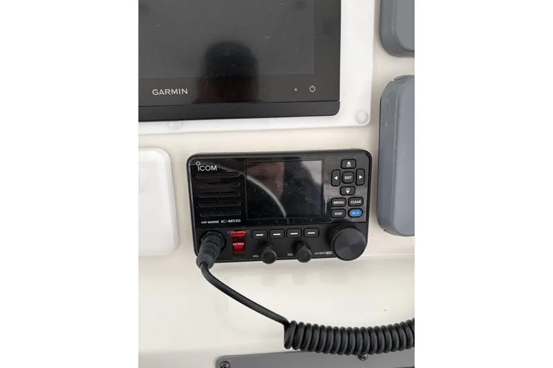  Yacht Photos Pics 2006 Rampage 38 Express boat dashboard with Icom VHF marine radio and Garmin display.