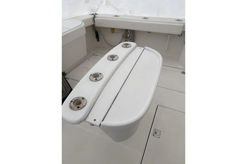  Yacht Photos Pics 2006 Rampage 38 Express boat interior with rod holders and storage compartments.