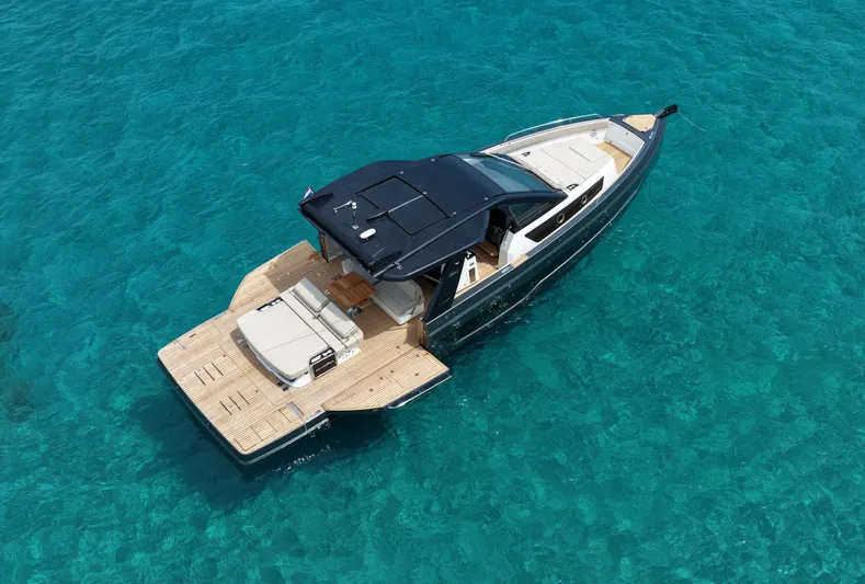  Yacht Photos Pics Luxury Schaefer V44 yacht cruising in clear turquoise waters, 2025 model.