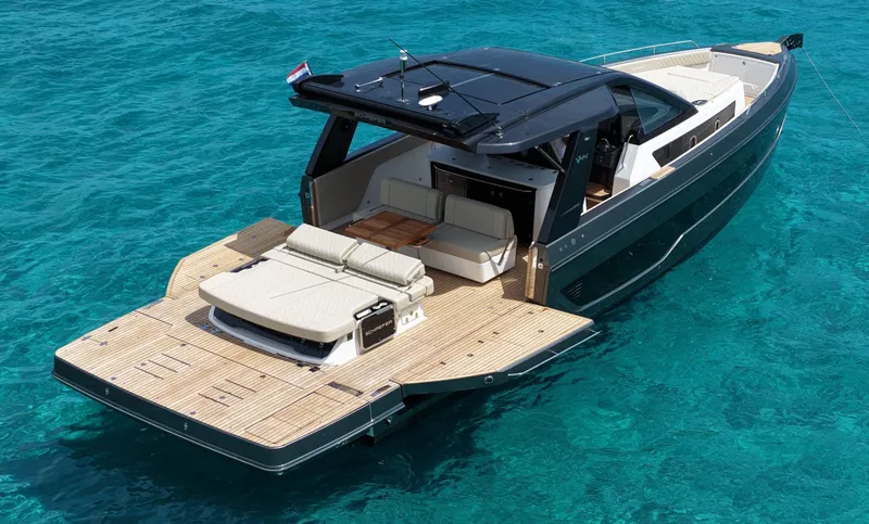  Yacht Photos Pics Luxury Schaefer V44 yacht, 2025 model, on clear turquoise water.