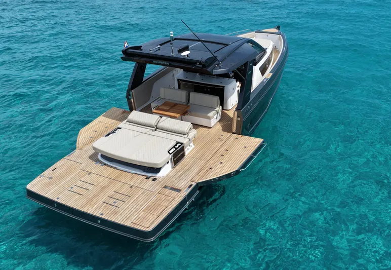  Yacht Photos Pics Luxury Schaefer V44 yacht, 2025 model, cruising on clear turquoise waters.
