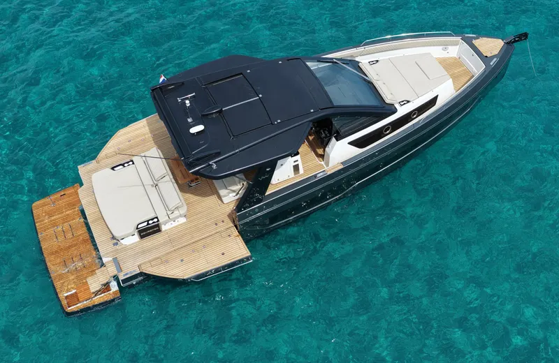  Yacht Photos Pics 2025 Schaefer V44 yacht on clear turquoise water, aerial view.