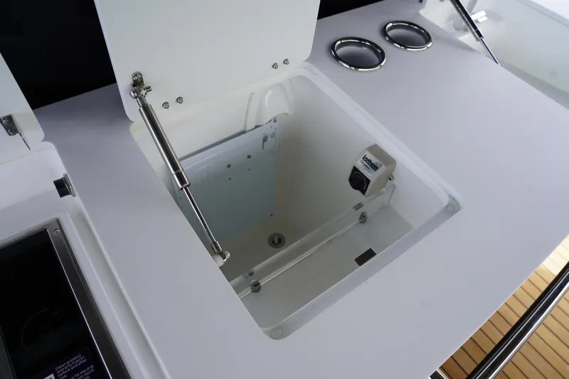  Yacht Photos Pics Open storage compartment on Schaefer V44 yacht, 2025 model, with hydraulic support.