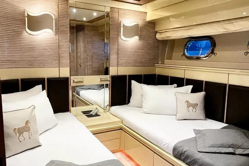  Yacht Photos Pics Luxurious cabin interior of 1995 Mondomarine 30 yacht with twin beds and elegant decor.