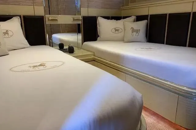  Yacht Photos Pics Luxurious twin cabin on 1995 Mondomarine 30 yacht with elegant bedding.