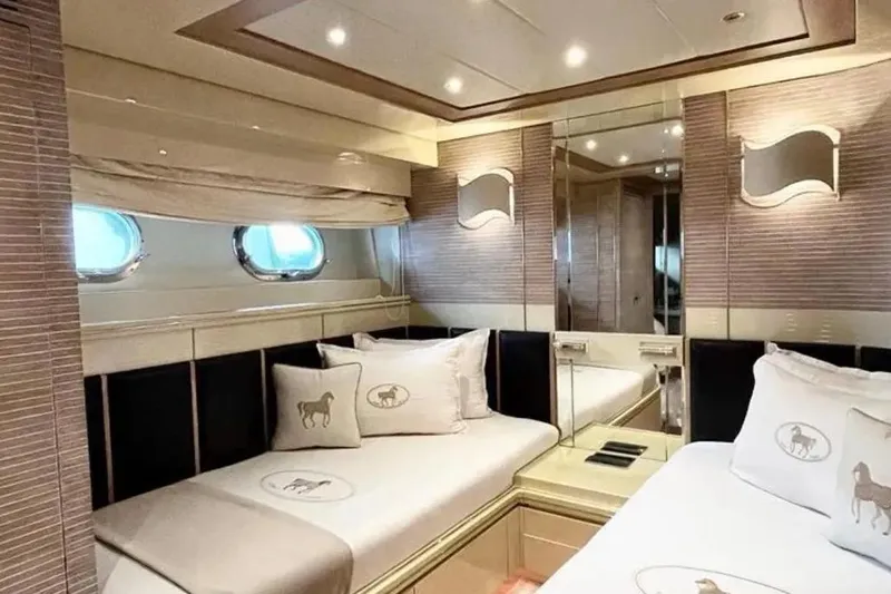  Yacht Photos Pics Luxurious cabin interior of 1995 Mondomarine 30 yacht with elegant decor and bedding.