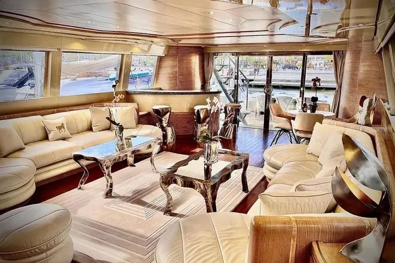  Yacht Photos Pics Luxurious interior of 1995 Mondomarine 30 yacht with elegant furnishings and panoramic windows.