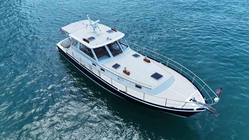 Fiji Yacht Photos Pics 1999 Grand Banks 49 Eastbay HX yacht cruising on open water.