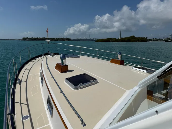 Fiji Yacht Photos Pics 1999 Grand Banks 49 Eastbay HX yacht on calm waters under a clear sky.