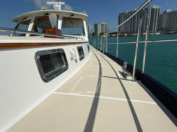 Fiji Yacht Photos Pics 1999 Grand Banks 49 Eastbay HX yacht deck with city skyline in background.