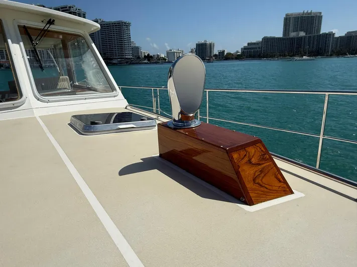 Fiji Yacht Photos Pics 1999 Grand Banks 49 Eastbay HX yacht deck with city skyline in background.
