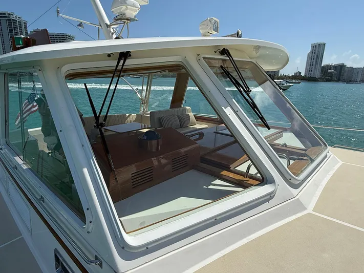 Fiji Yacht Photos Pics 1999 Grand Banks 49 Eastbay HX yacht with spacious deck and waterfront city view.