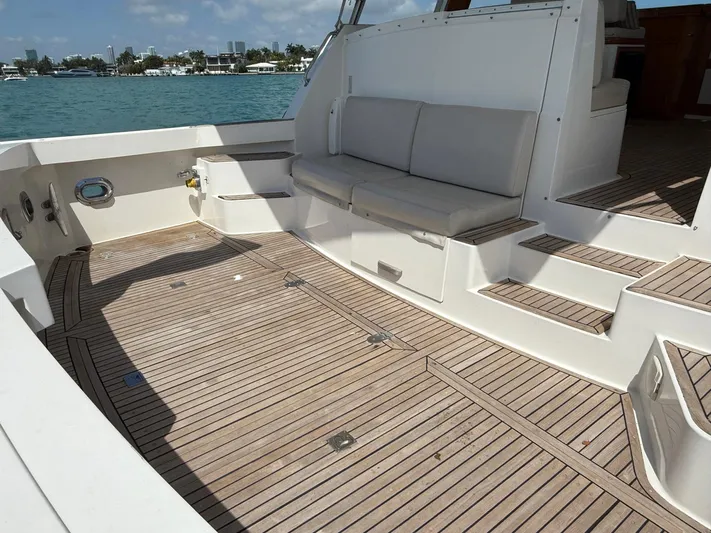 Fiji Yacht Photos Pics 1999 Grand Banks 49 Eastbay HX yacht deck with seating, overlooking calm waters.