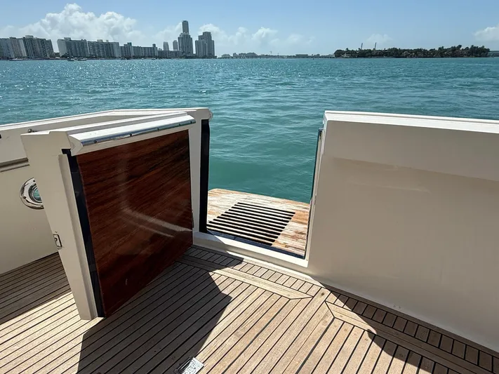 Fiji Yacht Photos Pics 1999 Grand Banks 49 Eastbay HX yacht with open deck view, overlooking city skyline and ocean.