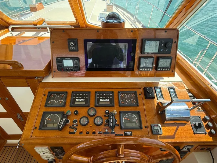 Fiji Yacht Photos Pics 1999 Grand Banks 49 Eastbay HX helm with wooden dashboard and navigation instruments.
