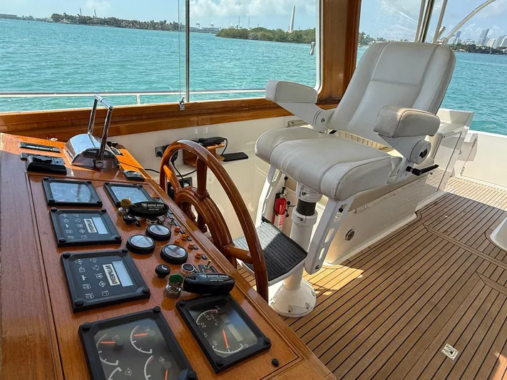 Fiji Yacht Photos Pics Helm of 1999 Grand Banks 49 Eastbay HX with controls and captain's chair, overlooking the ocean.