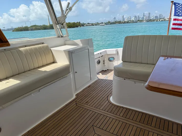 Fiji Yacht Photos Pics 1999 Grand Banks 49 Eastbay HX yacht interior with seating, wooden deck, and ocean view.