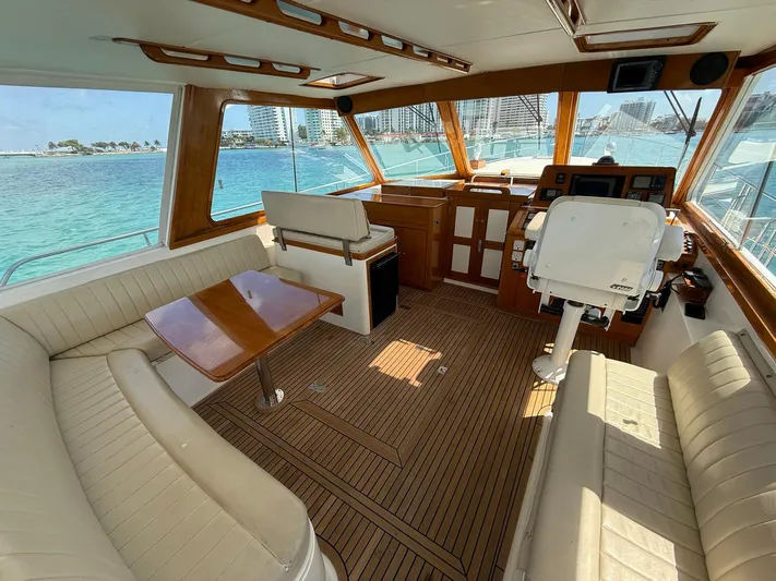 Fiji Yacht Photos Pics Interior of 1999 Grand Banks 49 Eastbay HX yacht with elegant seating and wooden finishes.