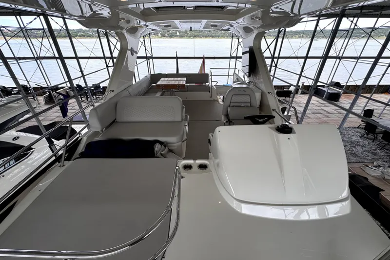 Smooth Yacht Photos Pics Luxurious 2018 Sea Ray Fly 460 yacht interior with spacious seating and scenic water view.