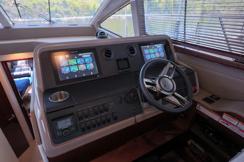 Smooth Yacht Photos Pics 2018 Sea Ray Fly 460 yacht helm with dual screens and modern controls.