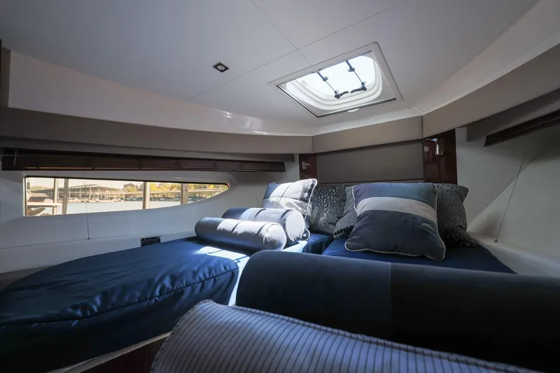 Smooth Yacht Photos Pics Luxurious interior cabin of 2018 Sea Ray Fly 460 yacht with plush bedding.