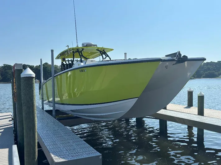 Big Sexy Yacht Photos Pics Bright yellow 2020 Prowler 42 boat docked on a sunny day.