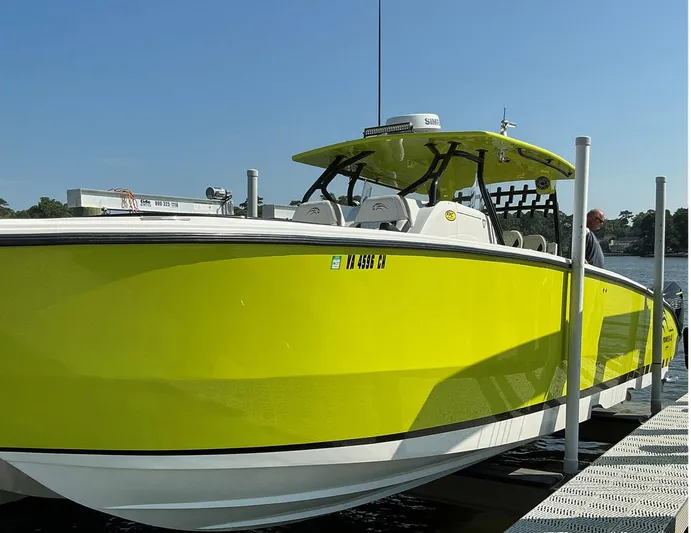 Big Sexy Yacht Photos Pics Bright yellow 2020 Prowler 42 boat docked on a sunny day.