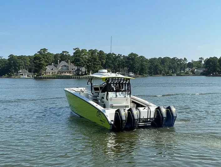 Big Sexy Yacht Photos Pics 2020 Prowler 42 boat with multiple engines on a serene lake.