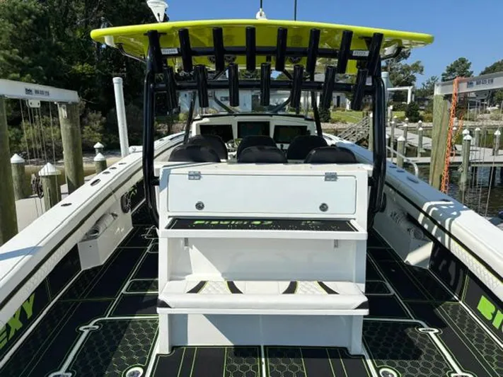 Big Sexy Yacht Photos Pics 2020 Prowler 42 boat with vibrant green accents docked at a marina.