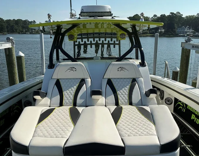 Big Sexy Yacht Photos Pics Luxury seating on a 2020 Prowler 42 boat, docked by a scenic waterfront.