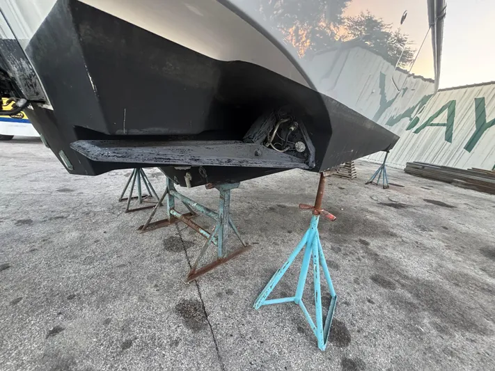  Yacht Photos Pics 2022 Fountain 38 SC boat on stands, showing hull and propeller area.