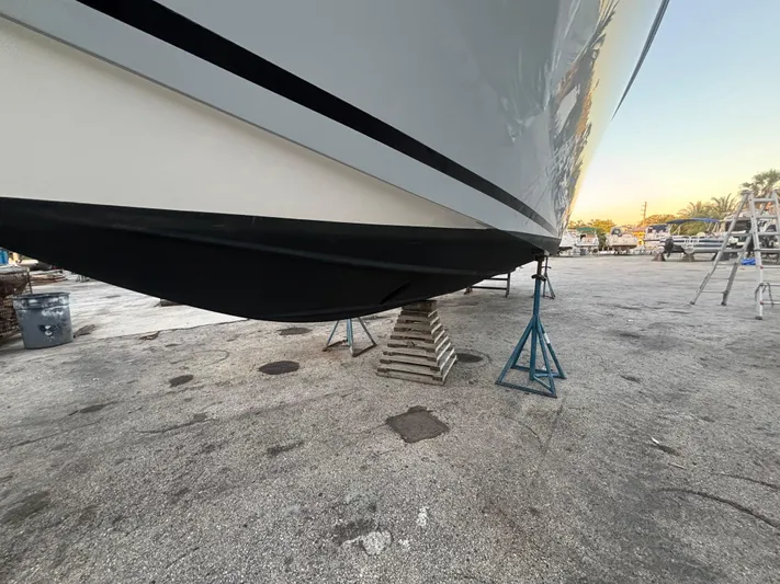  Yacht Photos Pics 2022 Fountain 38 SC boat on stands in a marina setting.