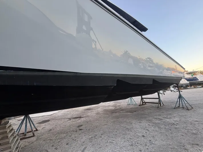  Yacht Photos Pics 2022 Fountain 38 SC boat on stands, side view, outdoors.