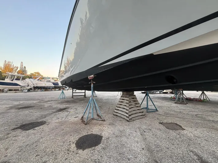  Yacht Photos Pics 2022 Fountain 38 SC boat on stands in a marina.