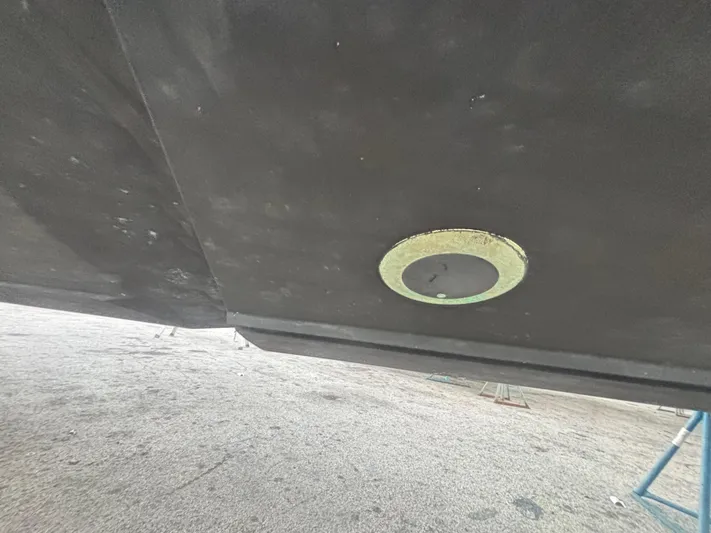  Yacht Photos Pics 2022 Fountain 38 SC boat hull with a circular fitting underneath.