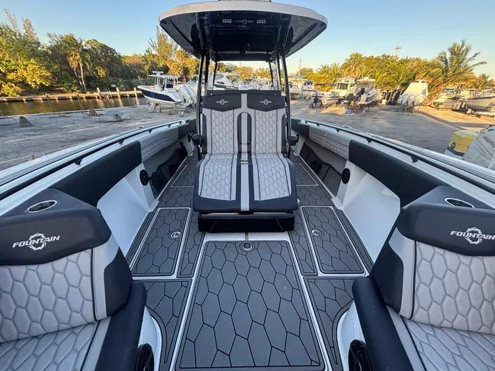  Yacht Photos Pics 2022 Fountain 38 SC boat interior with stylish seating and modern design.
