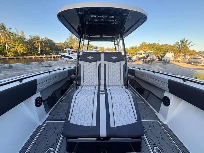  Yacht Photos Pics 2022 Fountain 38 SC boat interior with sleek seating and modern design.